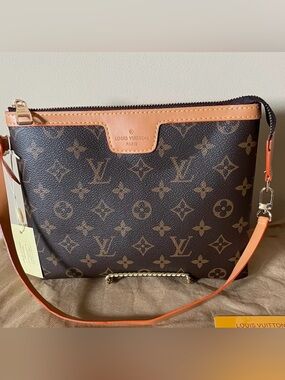 Monogram Shoulder Bag. 
     Asking $200.
Accepting Offers …